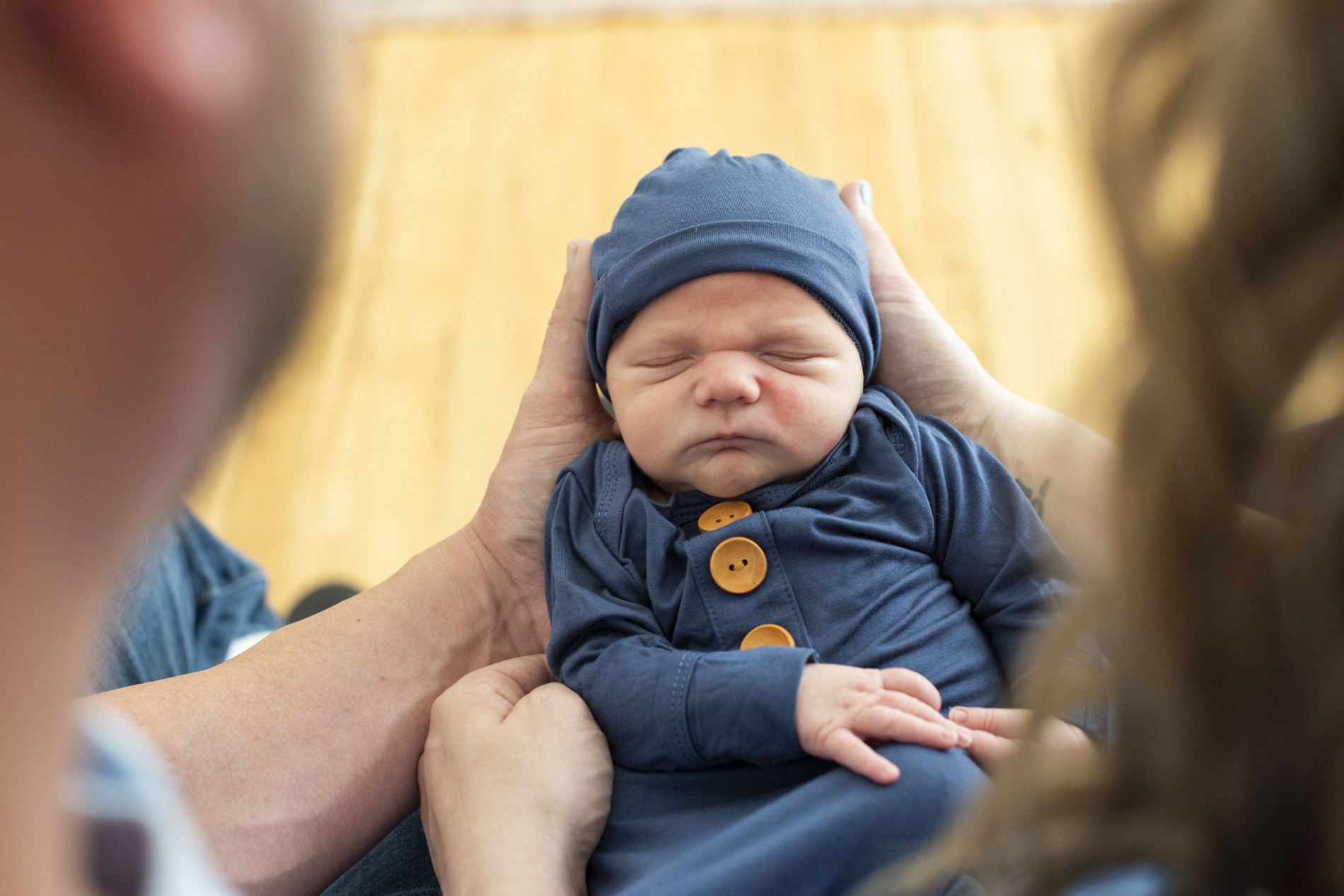 newborn baby in hands at newborn photography Asheville NC