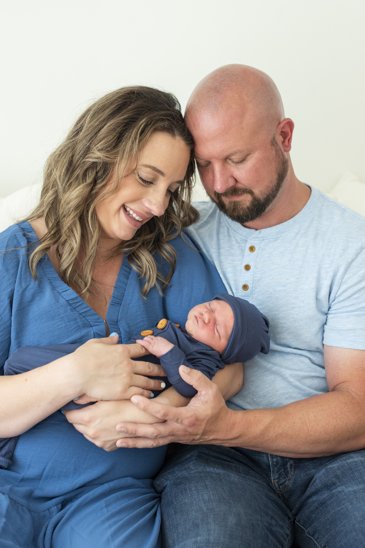 newborn baby in parents arms at newborn photography Asheville NC