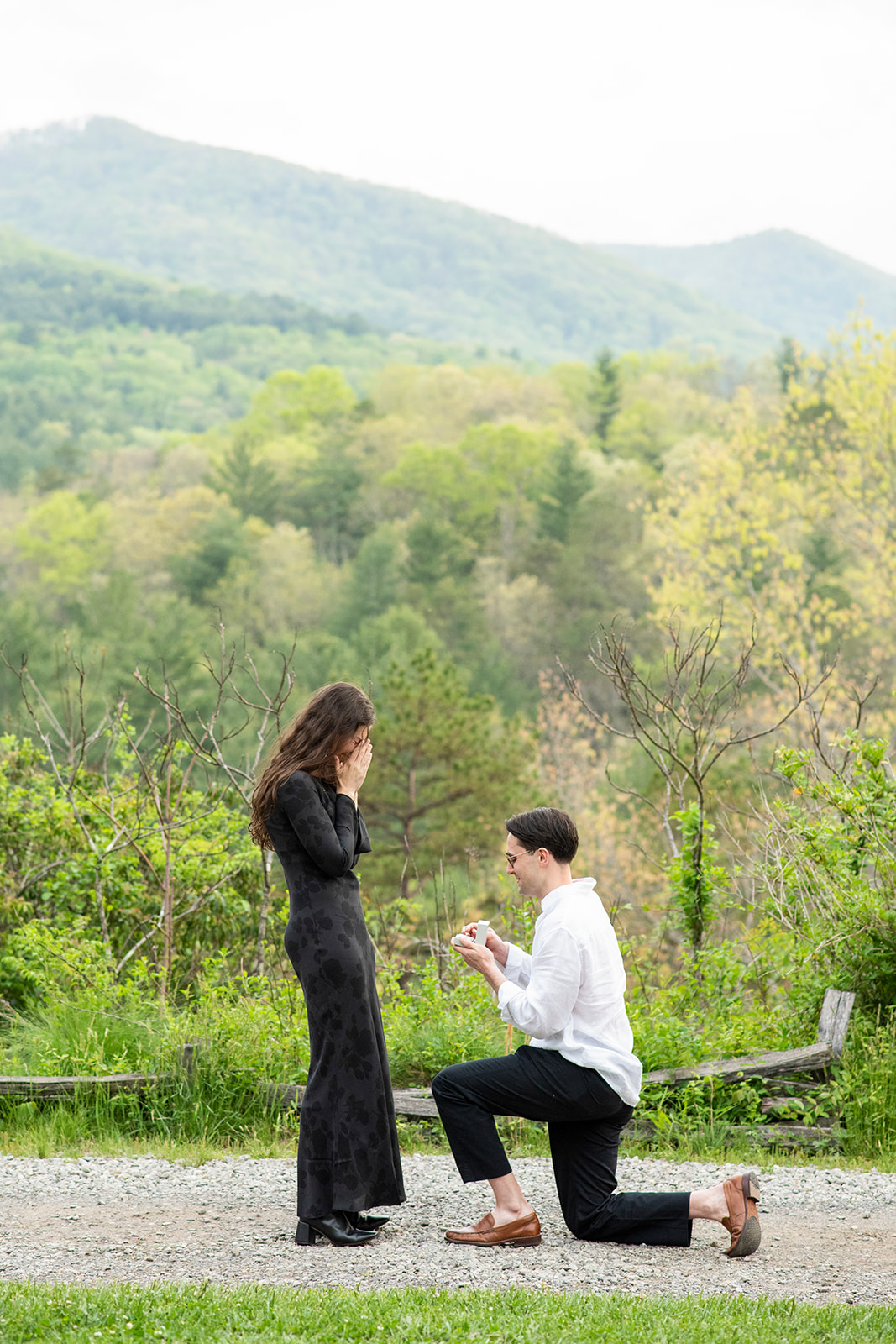 man on one knee proposing at NC Arboretum engagement