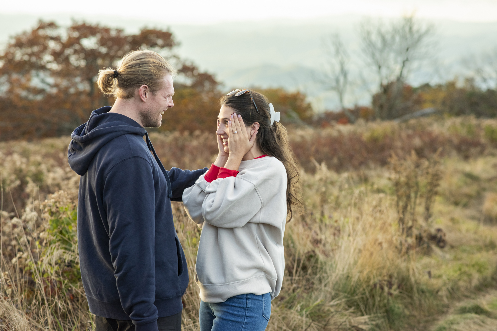 Woman shocked on mountain top with Asheville proposal photographer