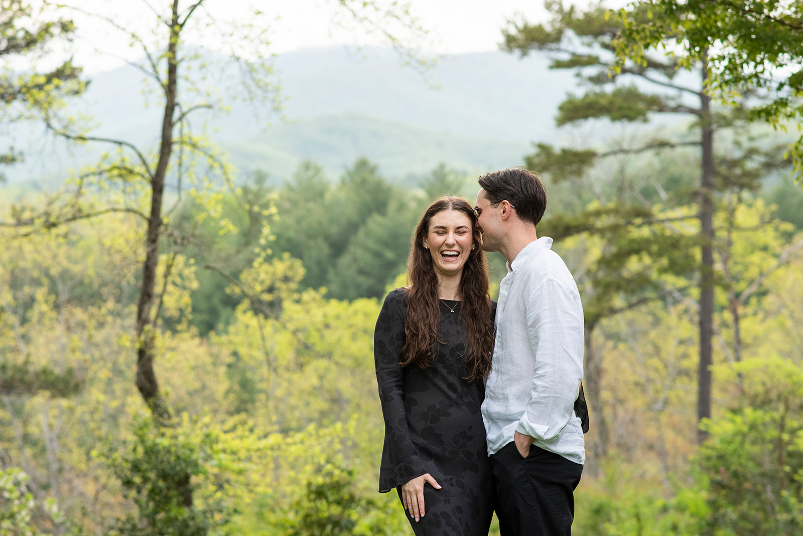 couple laughing at NC Arboretum engagement