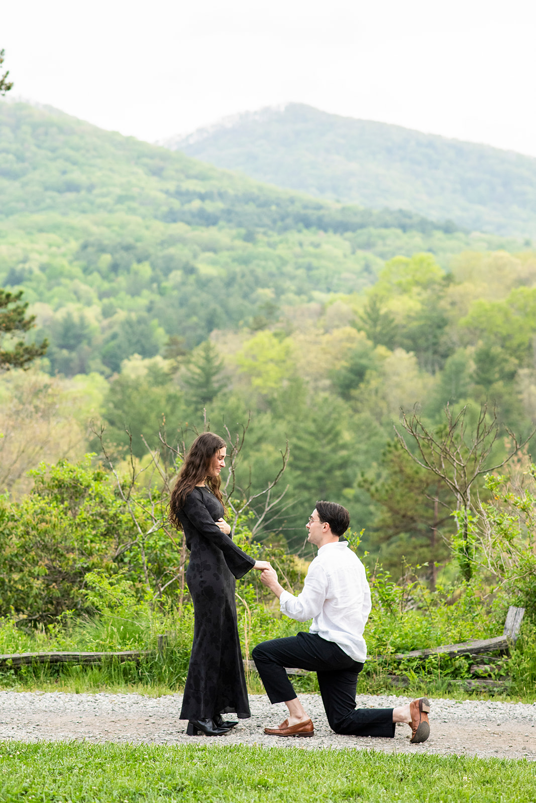 man on one knee proposing at NC Arboretum engagement in Places to propose in Asheville NC