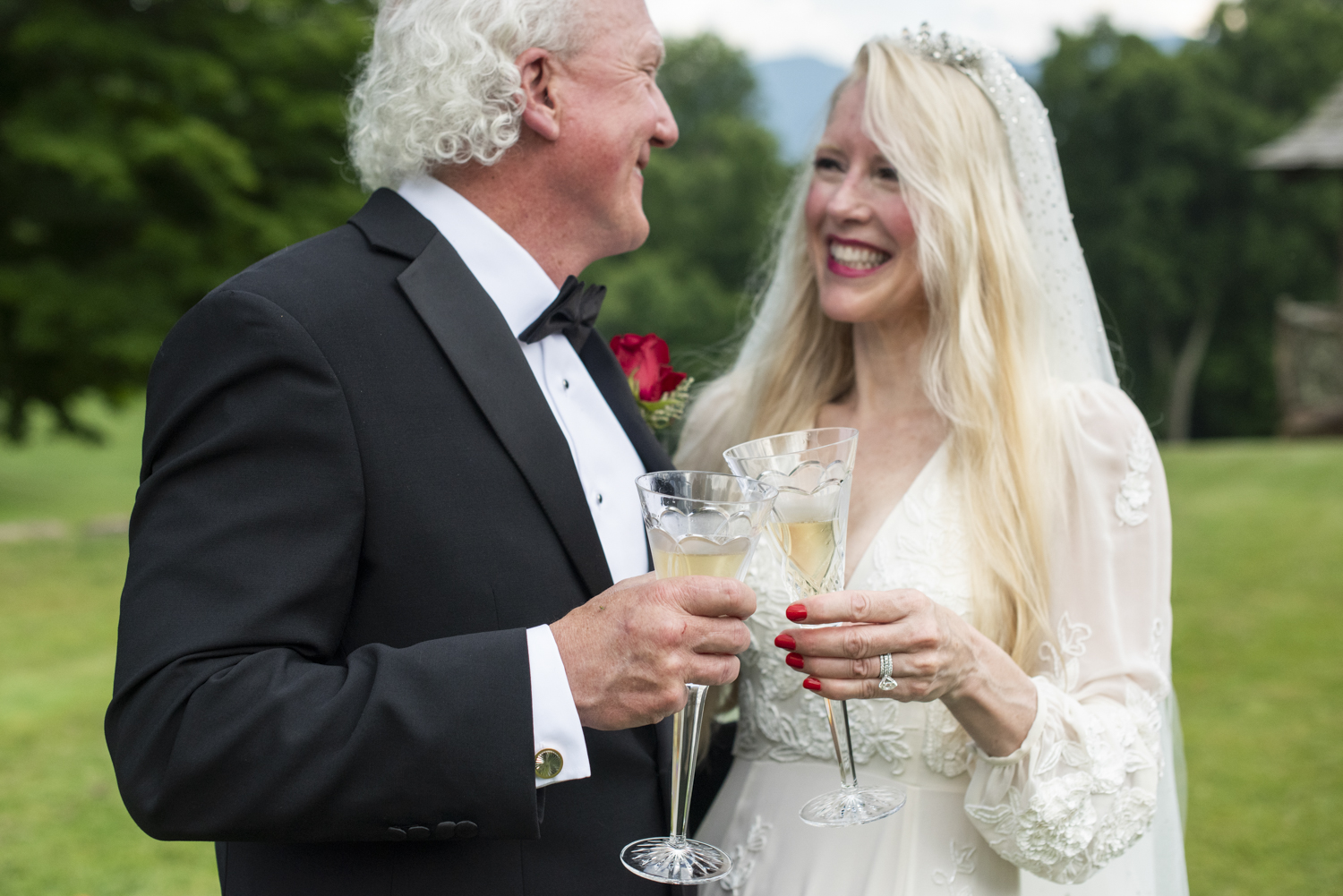 couple cheers with mountain views during asheville elopement