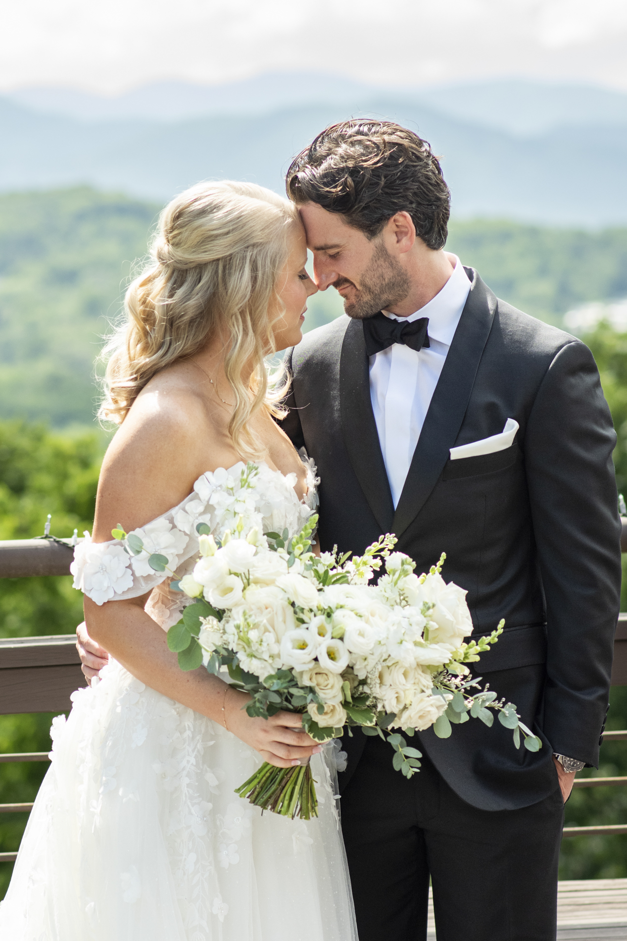 couple snuggling at asheville elopement