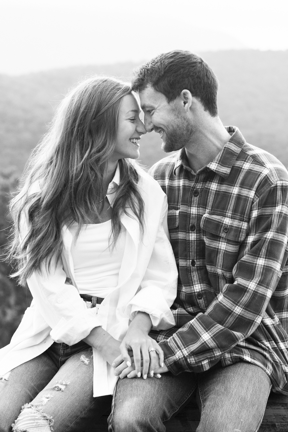 Blue Ridge Parkway Engagement photo of couple snuggling
