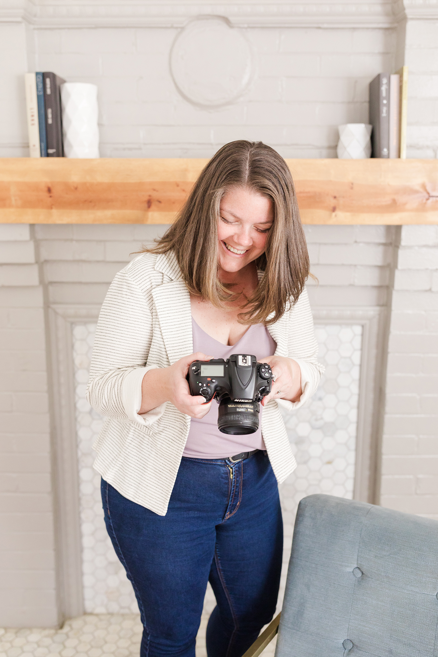 Photographer hand holding camera as women owned businesses in Asheville
