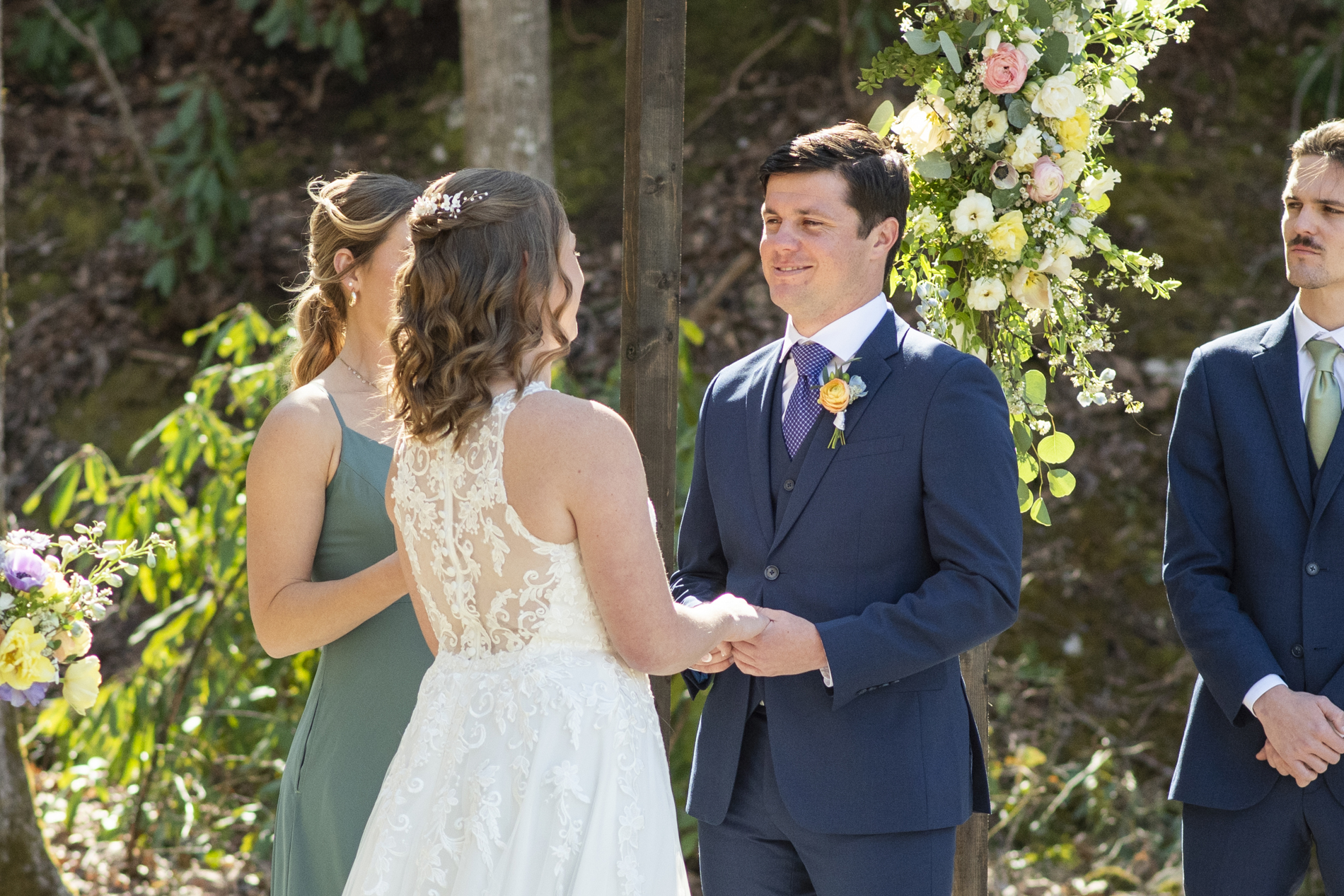 Groom smiling during ceremony at Hawkesdene wedding venue
