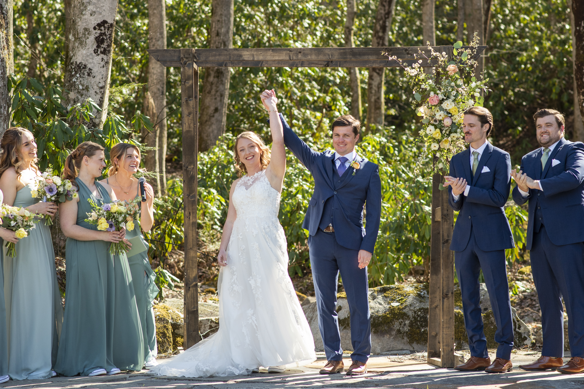 Couple celebrating during ceremony at Hawkesdene wedding venue