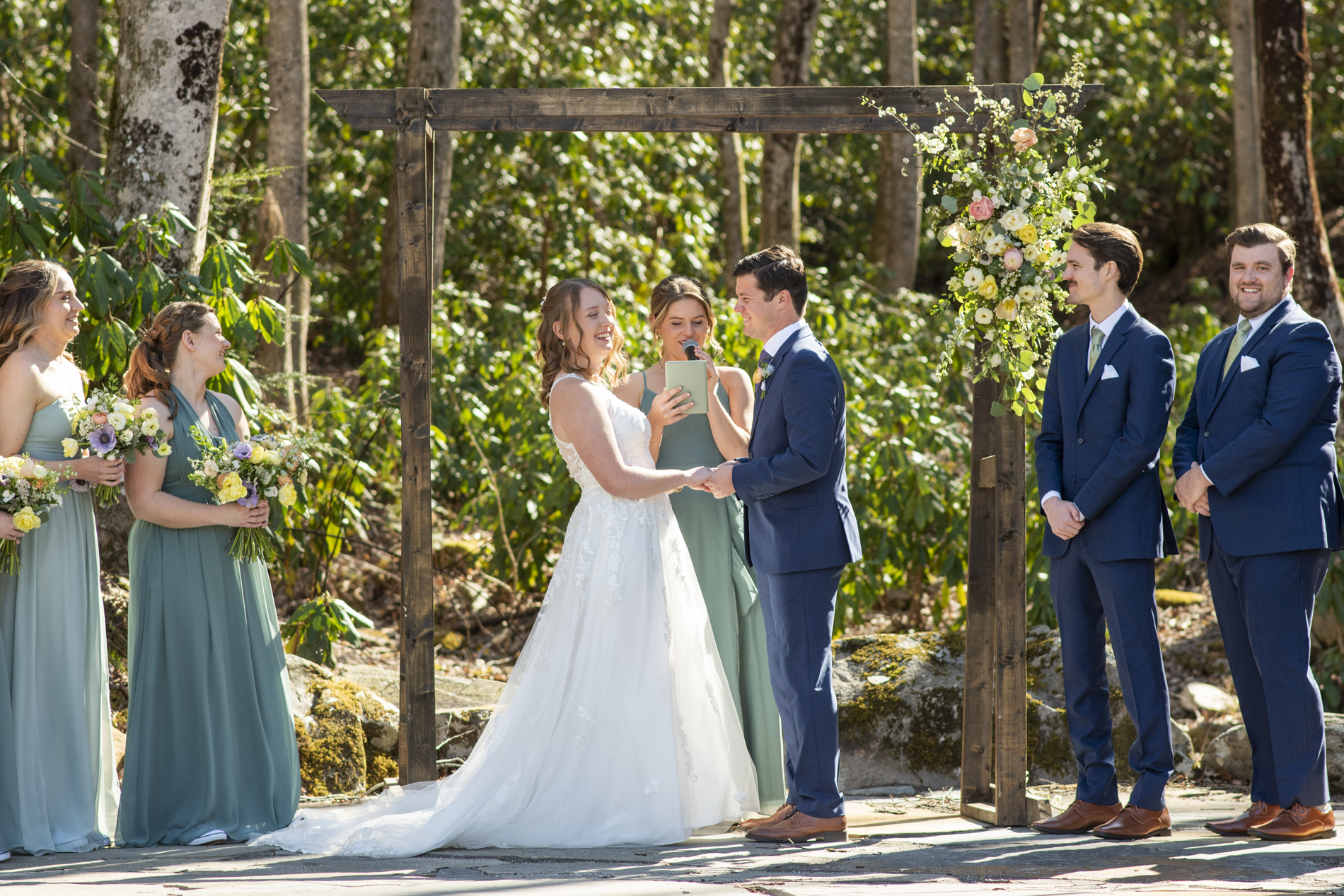 Couple laughing during wedding ceremony at Hawkesdene wedding venue
