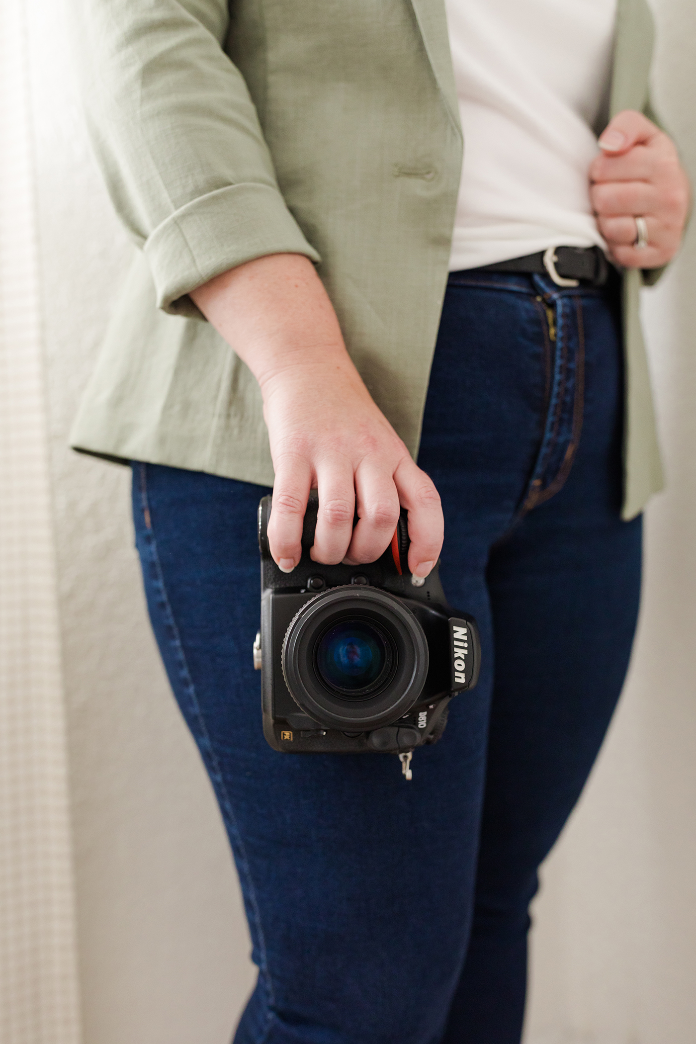 Photographer hand holding camera as women owned businesses in Asheville