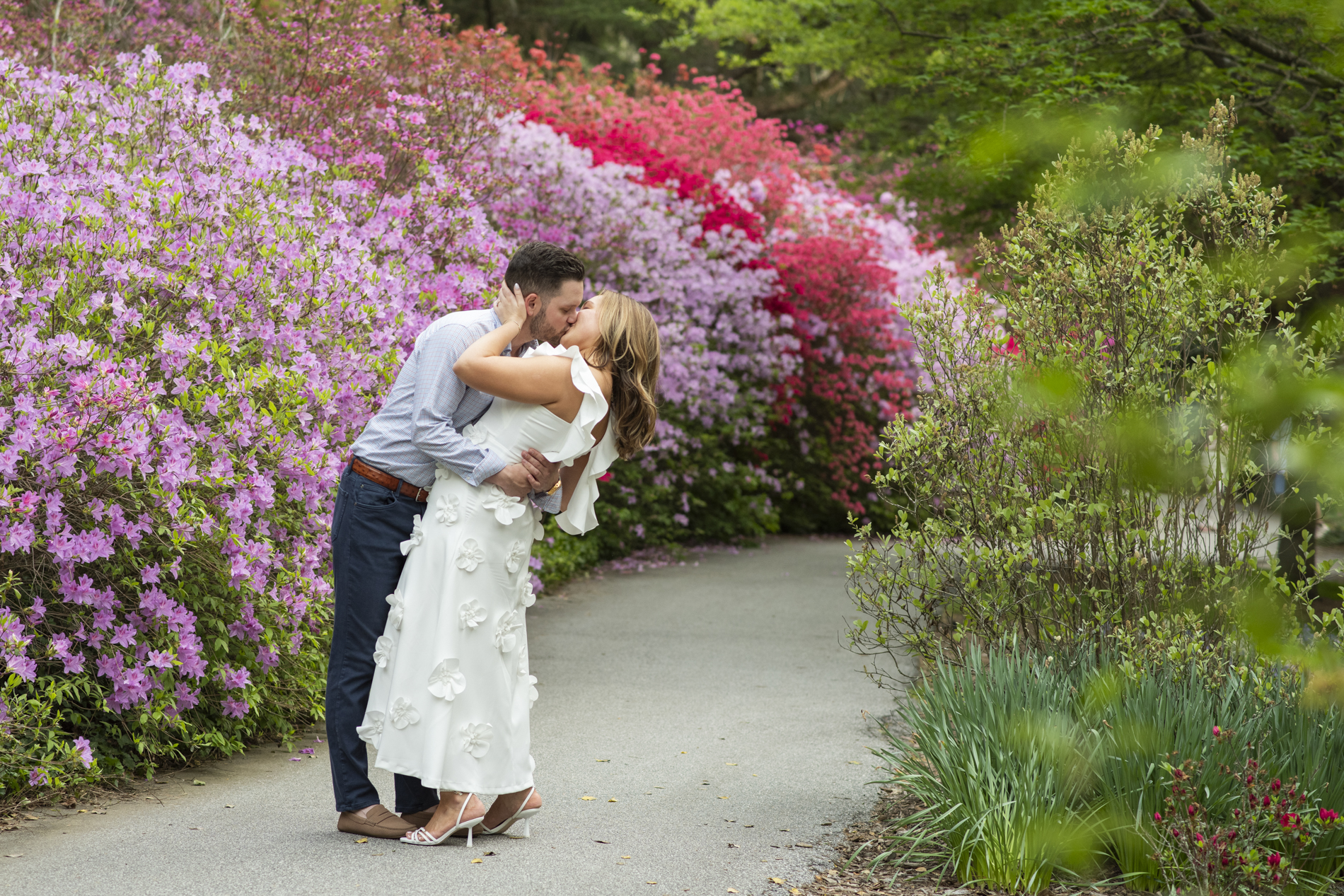 Couple kissing in Biltmore Azalea Garden in Asheville, NC