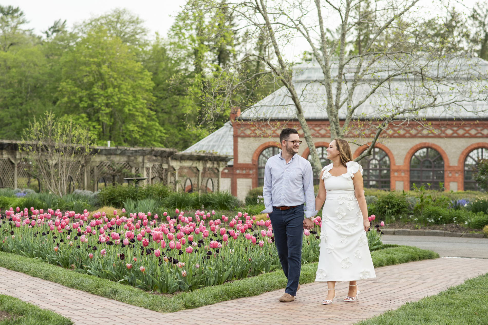 Couple walking among tulips at Biltmore Estate in Asheville, NC
