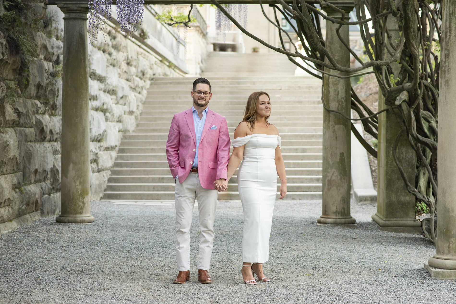 Engaged couple holding hands at Biltmore Estate