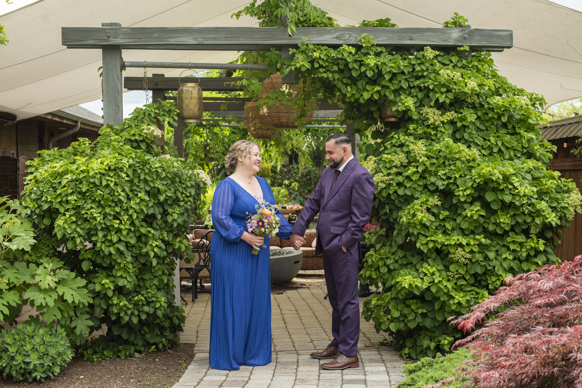 Groom and bride holding hands at Haiku Asheville