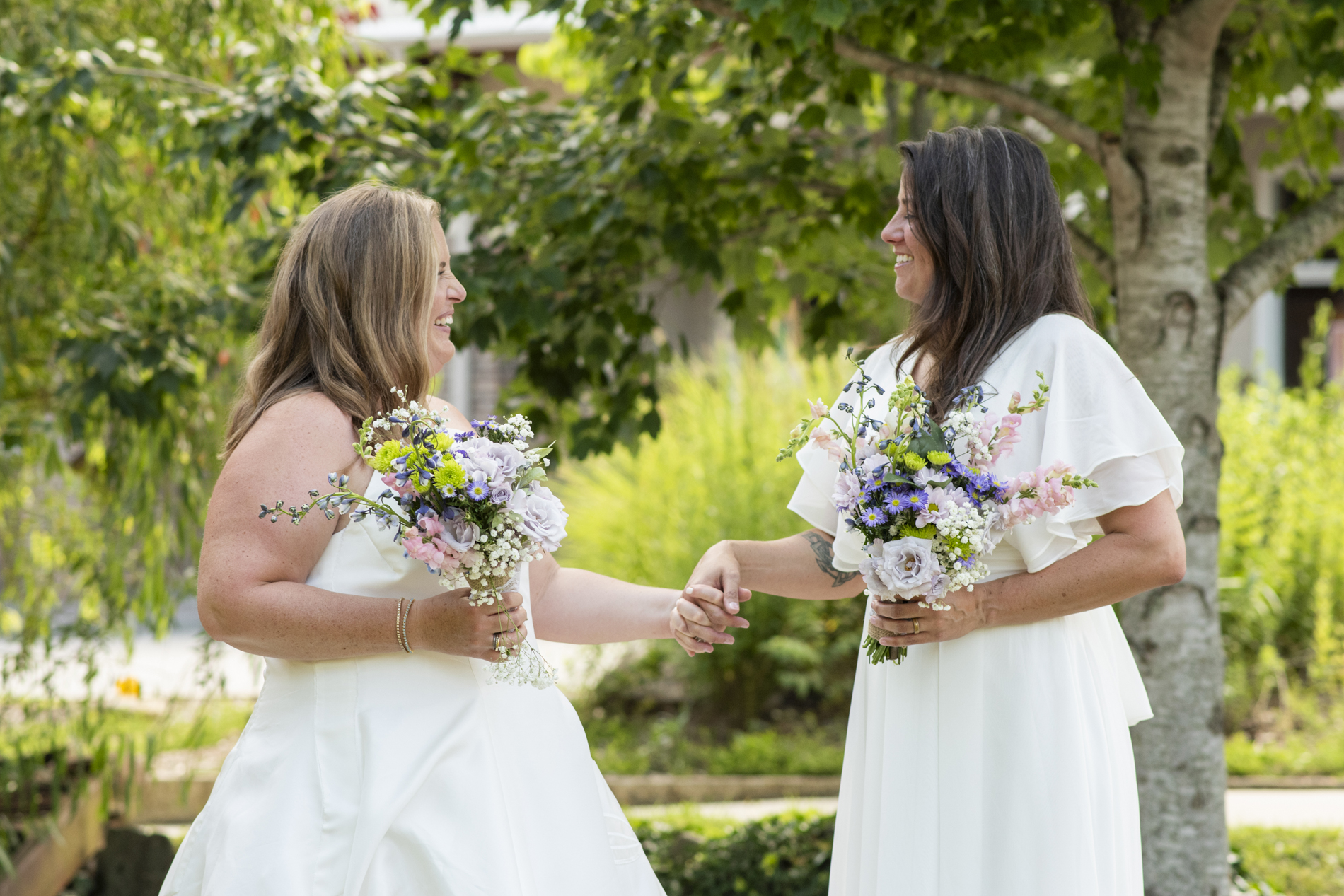Couple laughing at NuWray Hotel Wedding LGBTQ