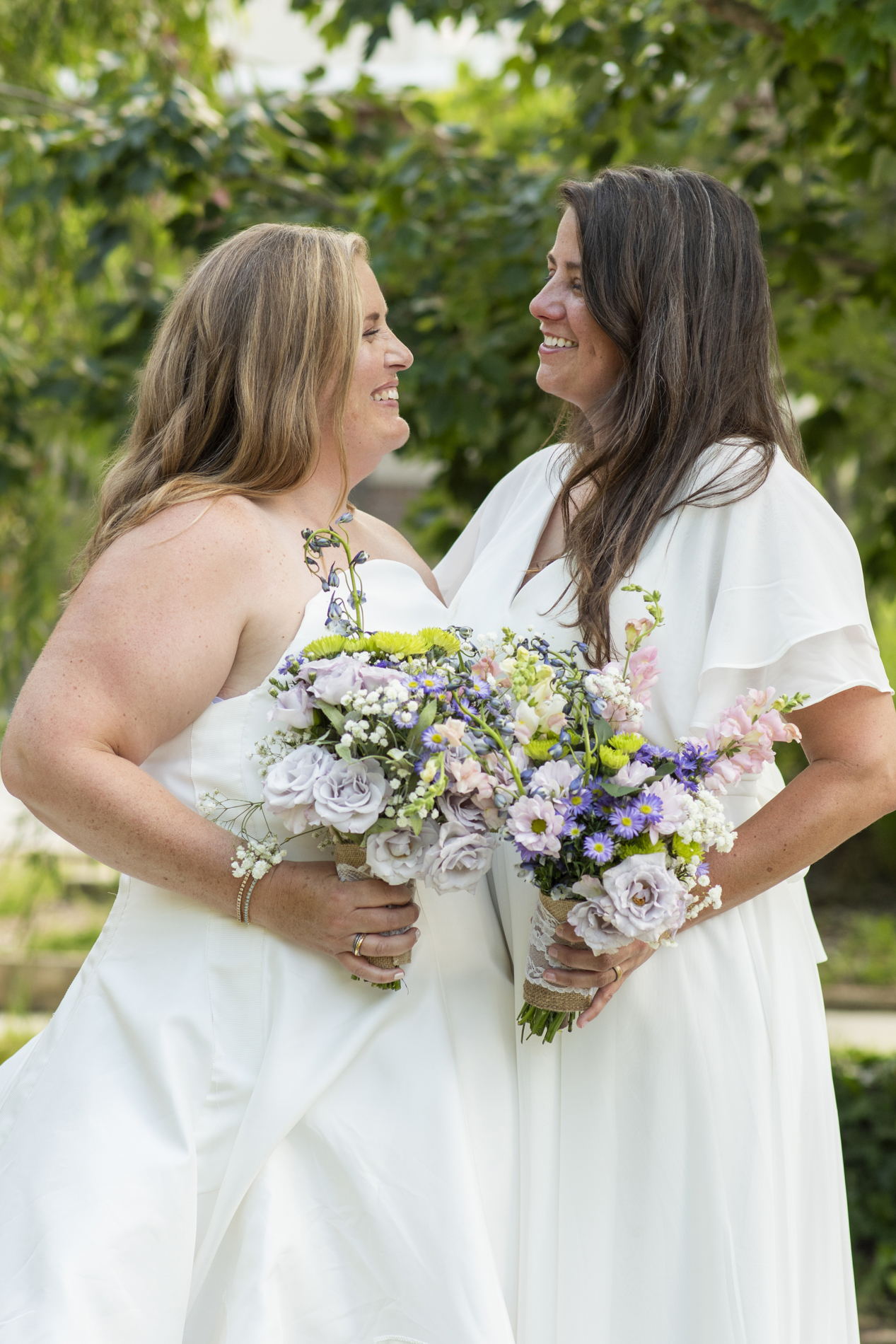 Couple holding flowers after NuWray Hotel Wedding