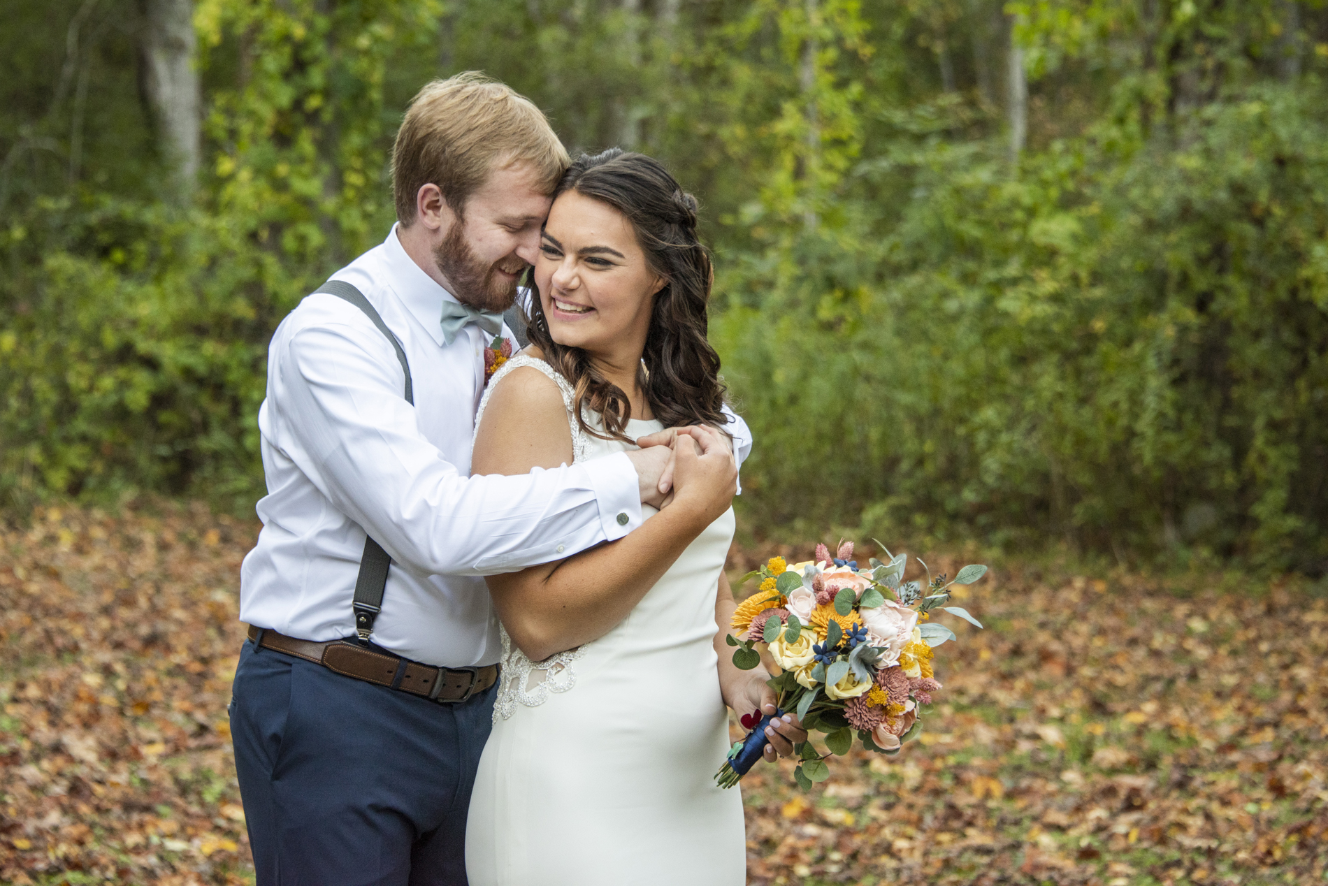 couple snuggling at asheville wedding