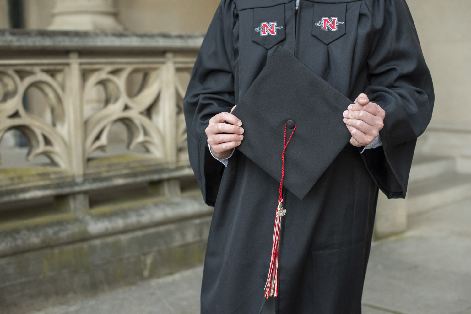 senior in cap and gown at biltmore estate