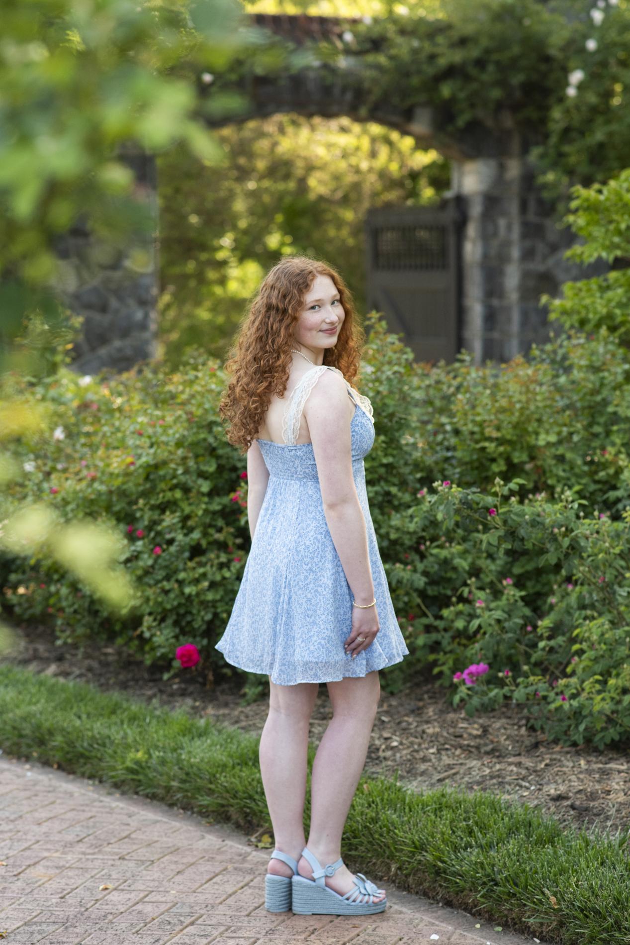 graduating senior at biltmore estate in rose garden