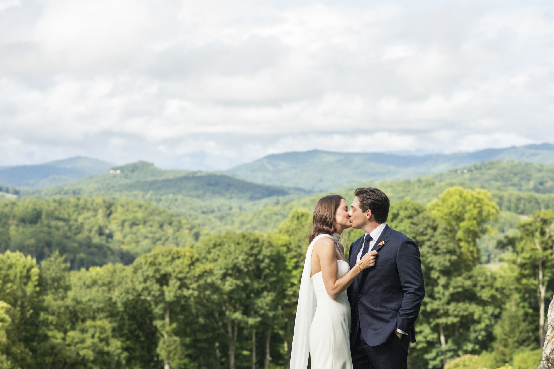 Couple kissing at wedding at Old Edwards Club in Cashiers, NC
