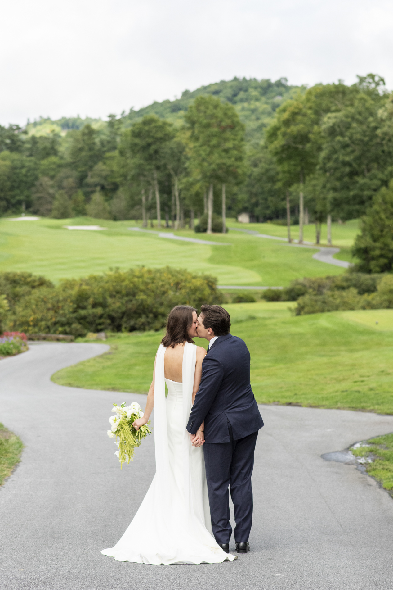 couple kissing on golf course