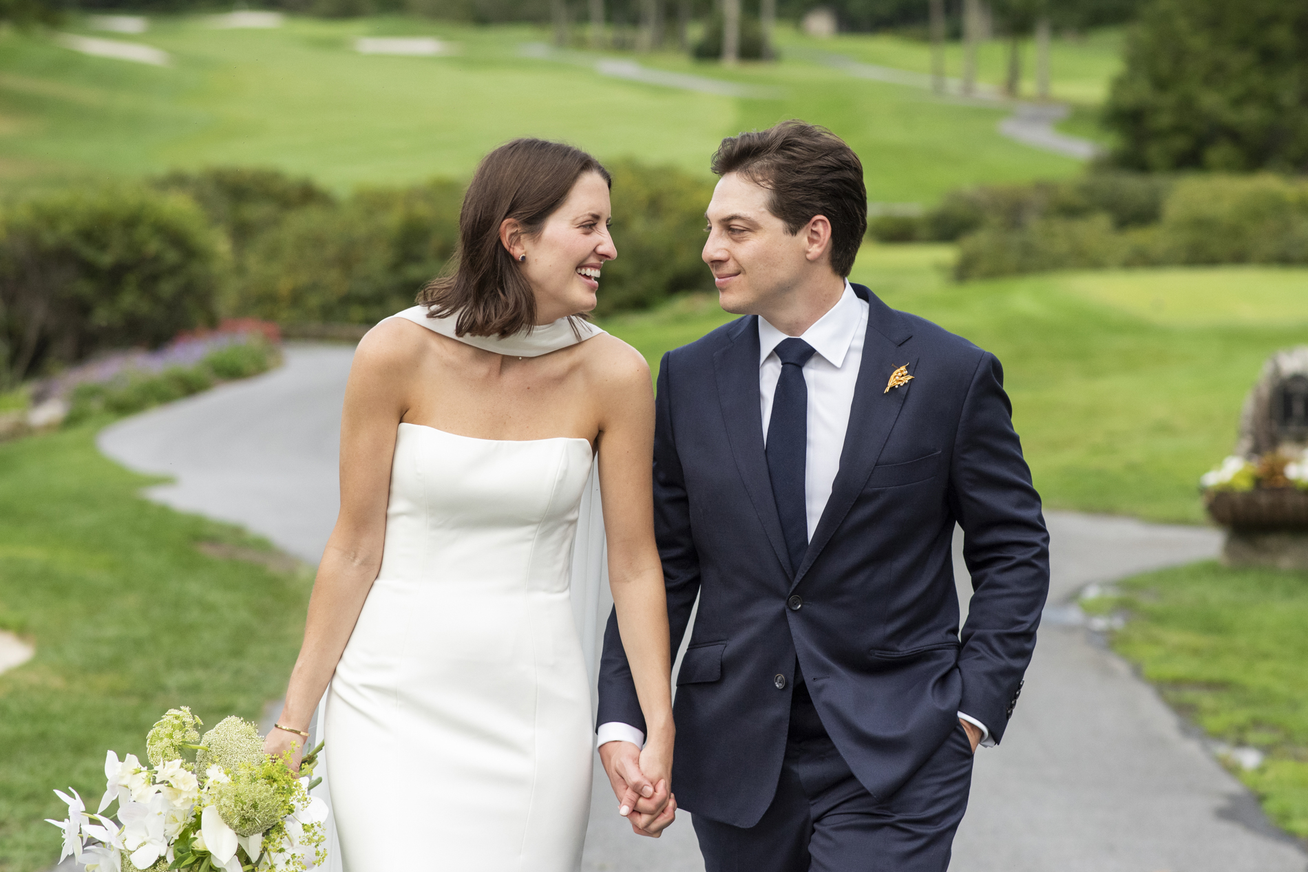 couple walking on golf course