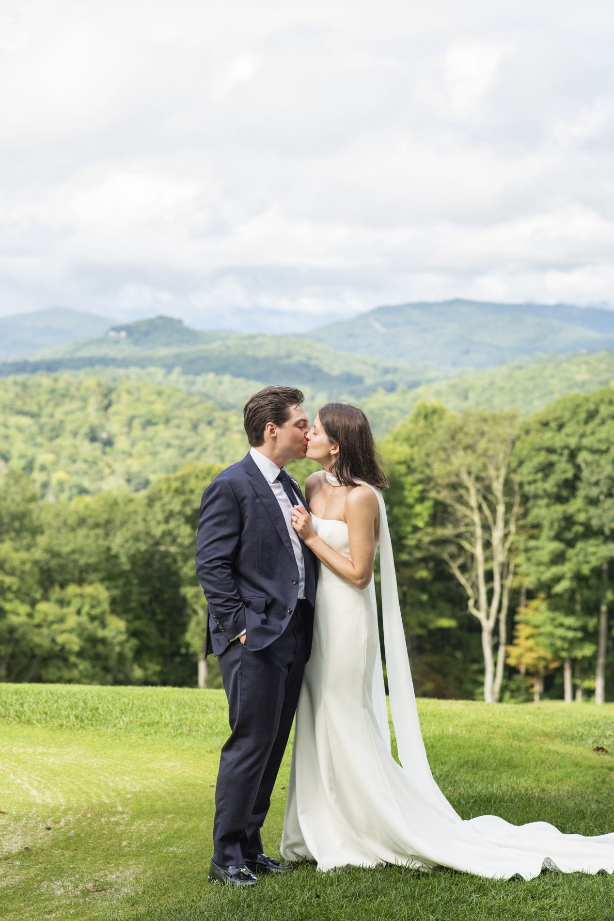 Couple kissing at wedding at Old Edwards Club in Cashiers, NC