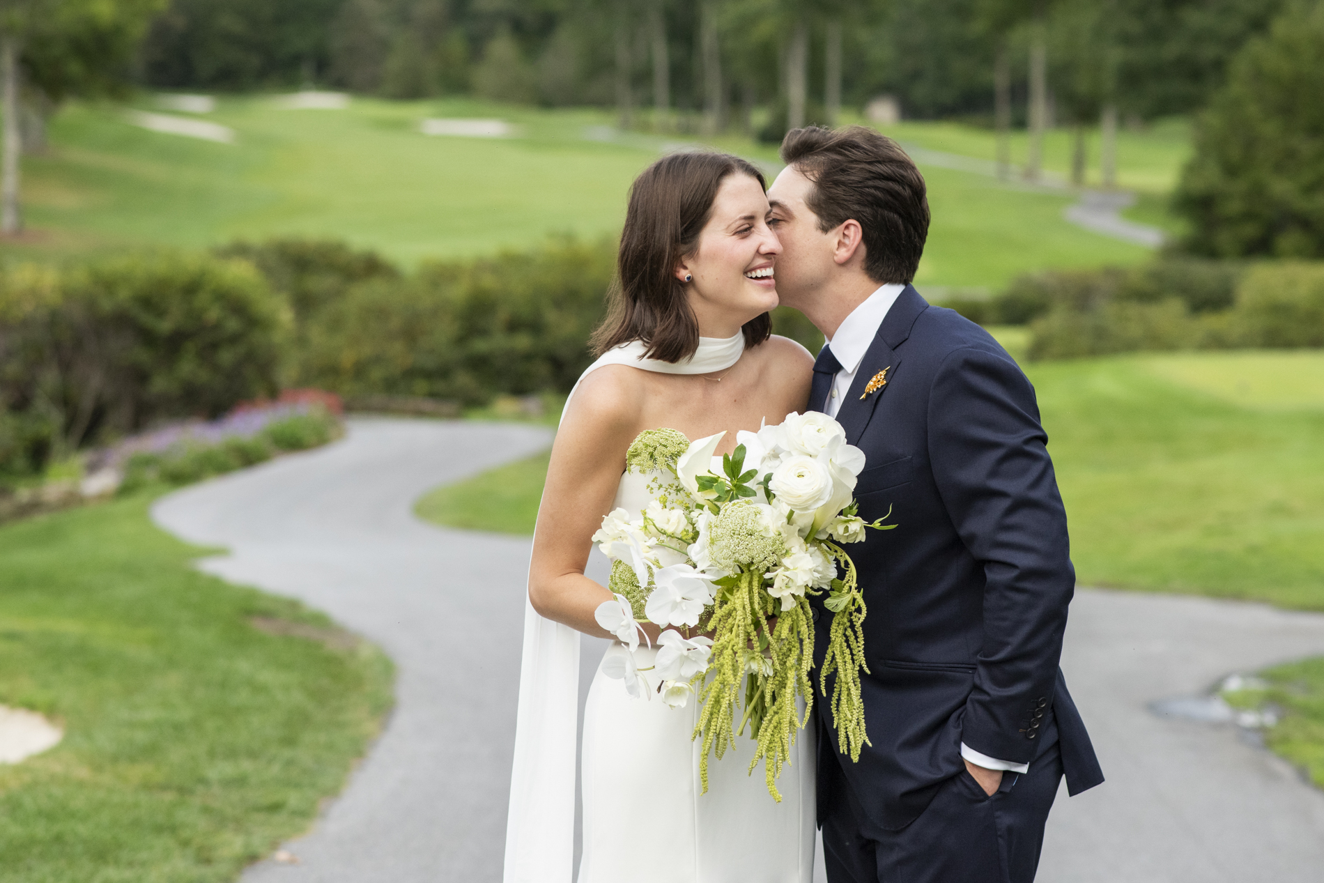 couple laughing on golf course