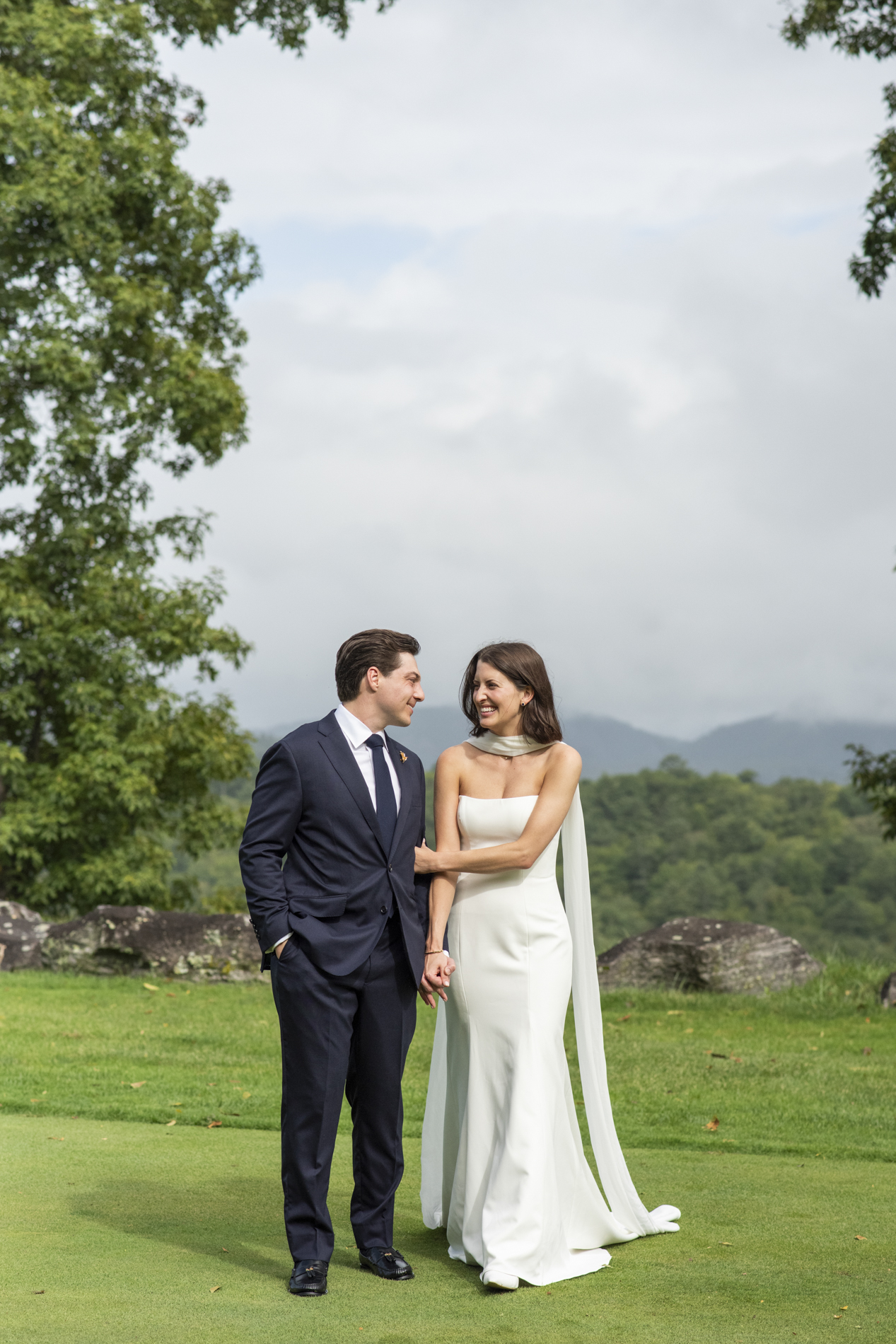 Couple walking at wedding at Old Edwards Club in Cashiers, NC